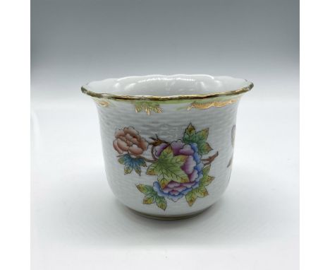 White porcelain designed with colorful florals, leaves and butterflies. Gilt rim with accents in design. Herend backstamp. Is