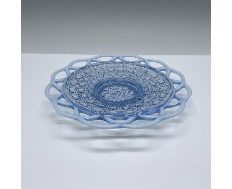 A beautiful light-blue glass with an opalescent milk glass laced edge. Issued: Mid 20th centuryDimensions: 7.5"W x 1"HConditi