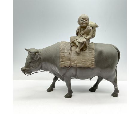 Detailed bronze of cow with boy sitting on grass mat, reading and carrying basket on his back. Etched makers mark. 7.2 lbs. I