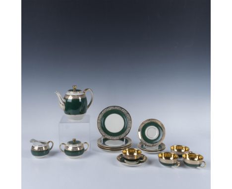 Elegant, banded green with gilt designed rim over creamy porcelain. Set includes teapot with lid (6"H); cream jug (2.75"H); d