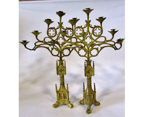 A large and impressive pair of 19th century continental puginesque seven light ecclesiastical candelabra, with fanned open-wo