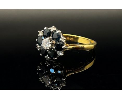 18ct sapphire and diamond cluster ring, centre diamond 0.20ct approx, size O/P, 4.7g 