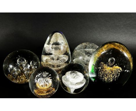 A collection of 19th, 20th century, glass paperweights mainly of clear glass design, bubbles and swirls, a Murano double heli