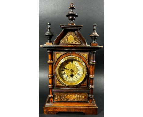 A small late 19th century German mantle clock, architectural form with inlaid case, 42 cm high, 23 cm wide, with pendulum and