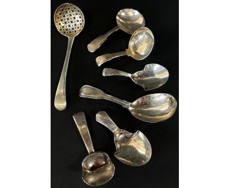 Six 19th century silver caddy spoons and one sugar casting spoon, 2.5oz (7) 