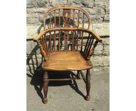 Early 19th century Windsor comb back elbow chair with shaped and pierced splat, principally in ash wood 
