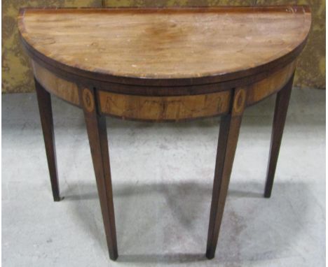 A Georgian mahogany demi lune card table with marquetry finish 