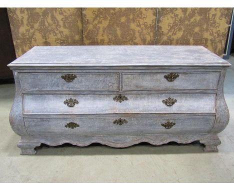 A large old Dutch Dry-scaped bombe commode chest, with two short and two long drawers, 175cm long x 54cm deep x 80cm high 