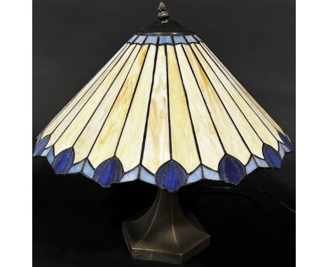 A Tiffany style lamp with a conical shaped “lead” segmented glass shade and two pyramid Tiffany style glass ceiling lights. 