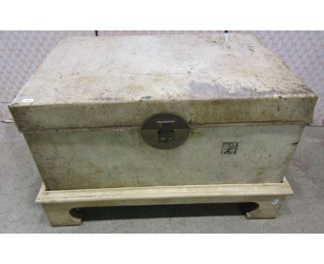 A Chinese vellum trunk on stand 