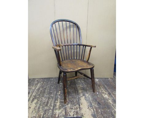 Two 19th century Windsor comb-back elbow chairs, in elm and beech (2)