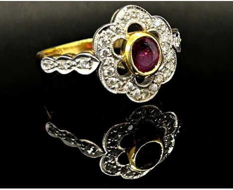 18ct oval ruby and diamond openwork cluster ring, Sheffield 1987, size O, 4.8g 