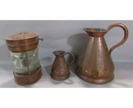 A Meteorite anchor copper and brass ship’s lantern 25cm high, together with a gallon and  a pint copper jug. 