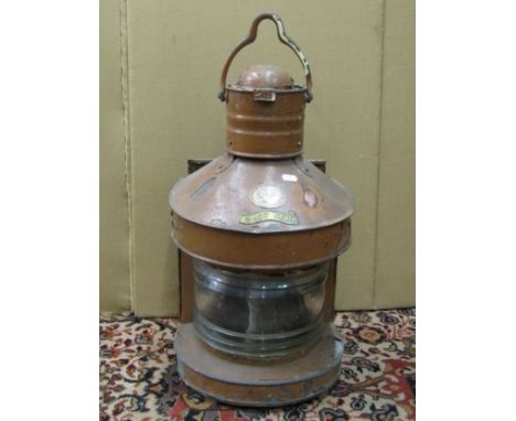 A copper mast head nautical lantern manufactured by Buyers Regency Quay Aberdeen ,with original burner and lens 