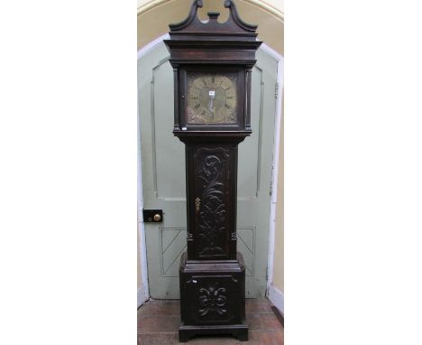 A Georgian oak longcase clock the case with later carved detail, enclosing a square brass dial with chased detail, 30 hour mo