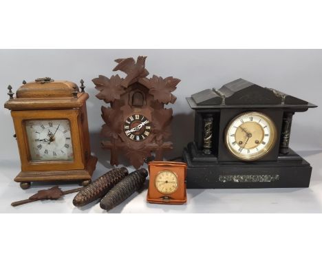 A small reproduction German cuckoo wall clock, together with a small polished slate and marble mantle clock and another repro