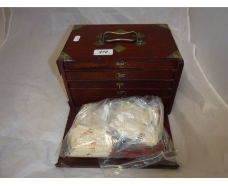 A teak-cased bone and bamboo mahjong set, a leather cased simulated ivory mahjong set and a bag containing various bone and o