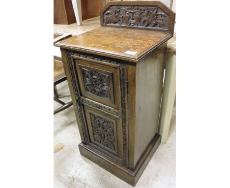 A late Victorian carved oak Gothic revival pot cupboard with an oak coffee table on barley twist legs together with a mahogan