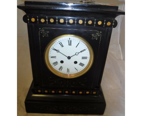 A black slate cased mantle clock with painted decoration