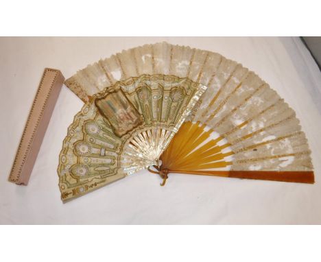 A 19th century mother of pearl stick fan with printed decoration depicting a lady in a boudoir highlighted with gold sequins 