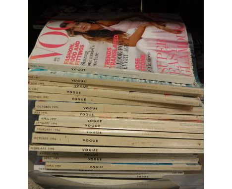 A large collection of various vintage Vogue magazines from 1990 onwards, Country Life magazines and a picture of a peacock