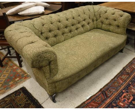 A Chesterfield sofa with green ground and floral upholstery