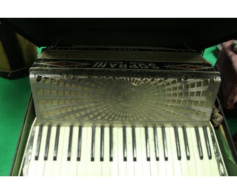 A vintage Soprani accordion and case