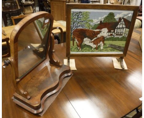 A dressing mirror together with an oak fire screen with needlework decoration behind a glazed front and a box containing vari