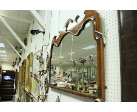 A 20th Century burr walnut veneered wall mirror in the 18th Century manner