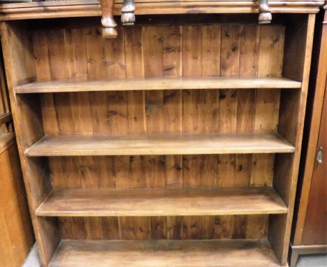 A stained pine four shelf bookcase together with a mahogany cabinet with adjustable shelves