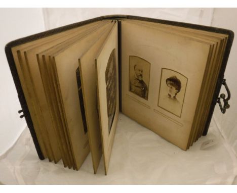 A Victorian leather photograph album and contents of assorted portrait photographs etc.