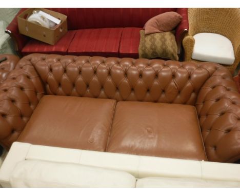 A pair of brown leather two seater chesterfield sofas CONDITION REPORTS Overall condition appears sound though button recesse