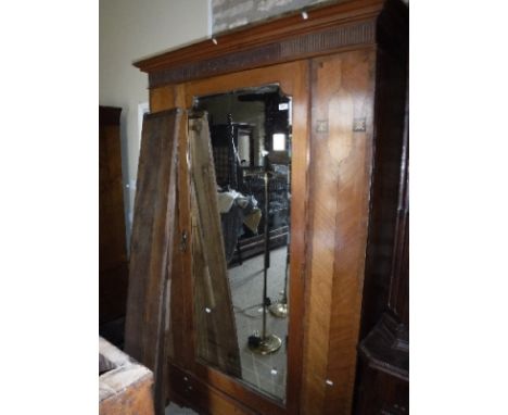 An Edwardian mahogany and inlaid single mirror door wardrobe with drawer