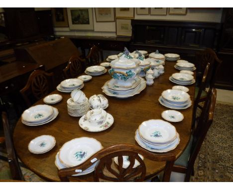 A modern French grape and vine painted dinner service comprising soup tureen, vegetable tureens, bowls, sauce boat, serving p
