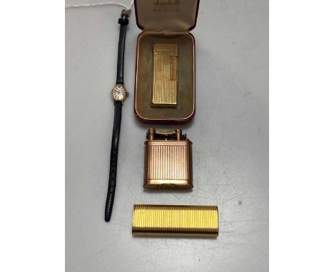 A Cartier cigarette lighter, a Dunhill cigarette lighter in the original case, a Dunhill lift arm cigarette lighter and a 9ct
