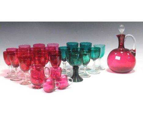 A quantity of early 20th century coloured glassware, to include various ruby glasses with clear stems and a single-handled ru