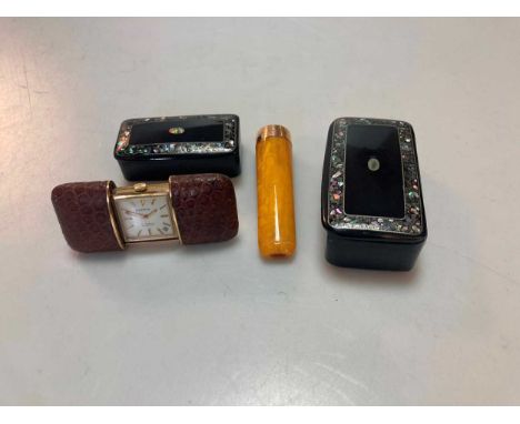 A 15ct gold mounted amber cigar holder, together with two decorative boxes and a travelling alarm clock (4)