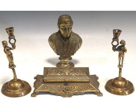 A pair of brass figural candlesticks, a brass bust of Pope Pius IX,20cm high, and a brass inkwell (4)Provenance:Collection of