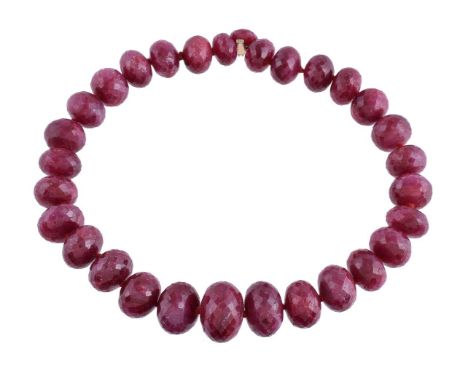 A facetted ruby bead necklace, the graduating facetted ruby beads, to a facetted ruby clasp set with an old cut diamond, 42cm