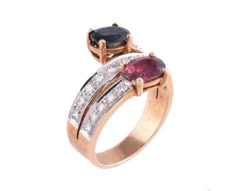 A ruby, sapphire and diamond ring, of crossover wraparound design, the terminals claw set with an oval shape sapphire, approx