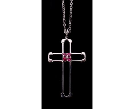 A ruby cross pendant, the openwork cross set with four circular cut rubies, approximately 0.47 carats total, on a belcher lin