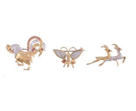 A diamond and ruby butterfly brooch, the butterfly wings set with brilliant cut diamonds, with two circular cut ruby accents,