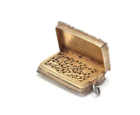 A George IV silver gilt rectangular vinaigrette by Nathaniel Mills, Birmingham 1829, with a vacant reserve on an engine turne