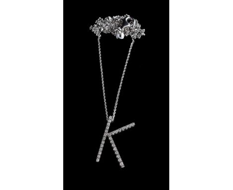 A diamond initial K pendant, the K set with brilliant cut diamonds, approximately 0.21 carats total, on a belcher link chain,