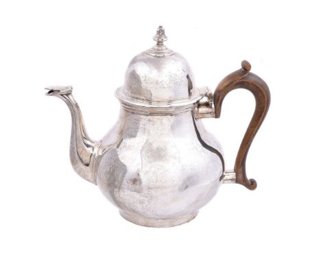 A silver baluster tea pot by Tessiers, London 1911, in early 18th century style, with a bell finial to the high domed cover, 