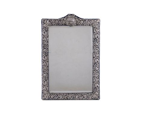 A late Victorian silver dressing table mirror by Henry Matthews, Birmingham 1900, rectangular with a raised top with tied rib