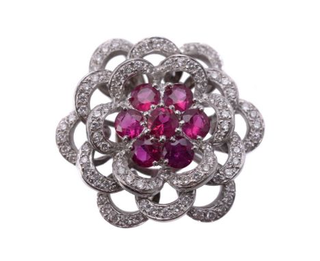 A ruby and diamond pendant, the flower head pendant set with a cluster of circular cut rubies, approximately 1.50 carats tota