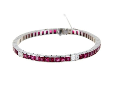 A ruby and diamond bracelet, the channel set sections of square cut rubies, approximately 9.70 carats total, with duos of pri