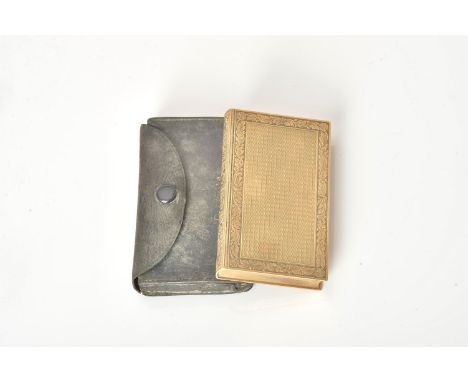 A 9 carat gold book form vanity box by Ramsden &amp; Roed, London 1937, the engine turned covers with foliate borders, the sp