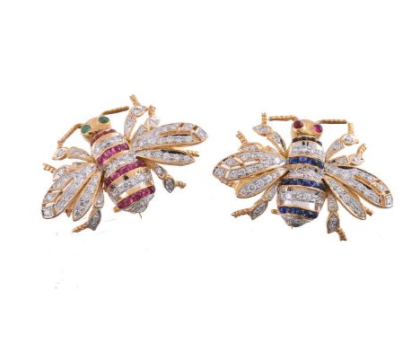 Two gem set bee brooches, the first set with brilliant cut diamonds, with bands of cabochon rubies and cabochon emerald eyes,